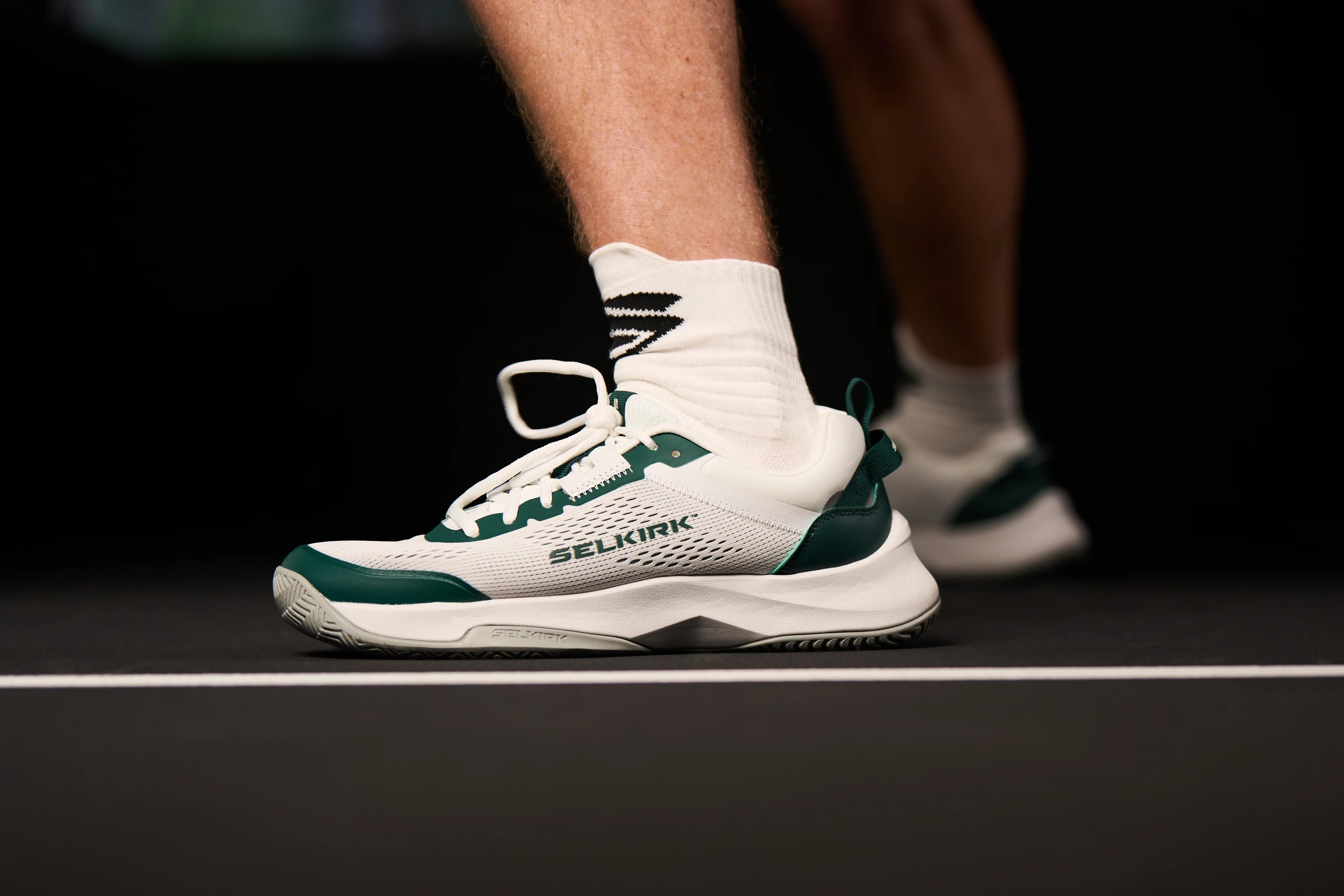 Selkirk CourtStrike Pickleball Shoes - Close Up On Pickleball Court - Green and White